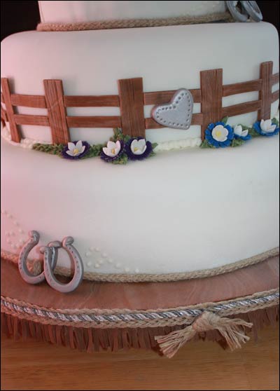 3tier western wedding cake with horseshoes Covered in fondant with faux 